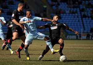 Images Dated 2013 April: Battle for the Ball: Coventry City vs. Brentford in Football League One at Ricoh Arena