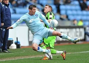 Images Dated 31st December 2011: Battle for the Ball: Coventry City vs. Brighton & Hove Albion in Npower Championship