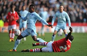 Images Dated 18th February 2012: Battle for the Ball: Elokobi vs. Nimely - Nottingham Forest vs