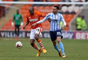 Images Dated 12th March 2016: Battle for the Ball: Emmerson Boyce vs. Jacob Murphy in Sky Bet League One Clash