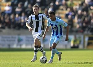 Sky Bet League One - Notts County v Coventry City - Meadow Lane Collection: Battle for the Ball: Grant Ward vs Garry Thompson - Sky Bet League One Rivalry at Meadow Lane