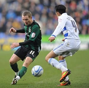 Images Dated 11th February 2012: Battle for the Ball: Jem Karacan vs. Gary McSheffrey - Coventry City vs