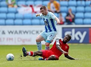 Images Dated 25th April 2015: Battle for the Ball: John Fleck vs. Anthony Grant - Coventry City vs