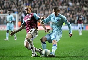 Images Dated 19th November 2011: Battle for the Ball: Jutkiewicz vs. Collison - Coventry City vs