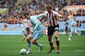 Images Dated 5th November 2011: Battle for the Ball: Jutkiewicz vs. Hooiveld - Coventry City vs. Southampton (Npower Championship)