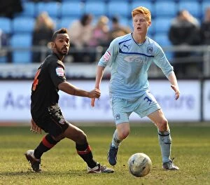 Images Dated 6th April 2013: Battle for the Ball: Logan vs Haynes in Coventry City vs Brentford Clash (Npower League One)
