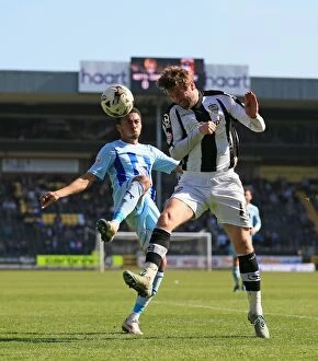 Sky Bet League One - Notts County v Coventry City - Meadow Lane Collection: Battle for the Ball: McCourt vs. Ward in Sky Bet League One Clash at Meadow Lane