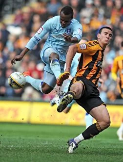 31-03-2012 v Hull City, KC Stadium Collection: Battle for the Ball: Nimely vs. Hobbs in the Intense Npower Championship Clash
