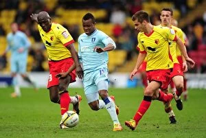 17-03-2012 v Watford, Vicarage Road Collection: Battle for the Ball: Nimely vs. Kacaniklic - Coventry City vs