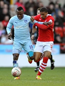Images Dated 18th February 2012: Battle for the Ball: Nimely vs McCleary in Nottingham Forest vs Coventry City Championship Clash