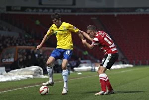 Images Dated 15th December 2012: Battle for the Ball: Tommy Spurr vs. Adam Barton, Doncaster Rovers vs