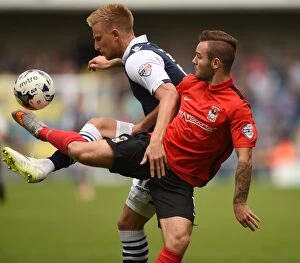 Sky Bet League One - Millwall v Coventry City - The New Den Collection: Battle for the Ball: Webster vs. Armstrong in Millwall vs. Coventry City (Sky Bet League One)