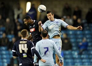 Images Dated 1st November 2011: Battle for the Ball: Wood vs. Trotter in Millwall vs. Coventry City Championship Clash