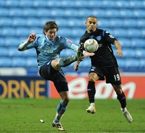 Images Dated 12th January 2010: Battle for the FA Cup: Coventry City vs. Portsmouth - Aron Gunnarsson vs. Danny Webber