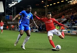 Images Dated 25th March 2016: Battle for Supremacy: Santos vs. Murphy in Sky Bet League One Clash between Peterborough United