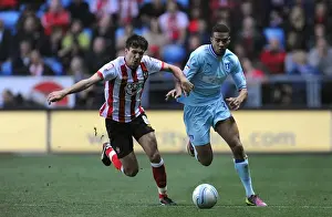 Battleground Ricoh Arena: Cyrus Christie vs Jack Cork - A Football Rivalry Unfolds