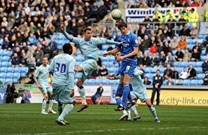 Images Dated 10th March 2012: Battling for Championship Supremacy: Zigic vs. Keogh at Ricoh Arena