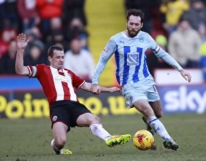 Sky Bet League One - Sheffield United v Coventry City - Bramall Lane Collection: Battling for Control: Doyle vs. O'Brien in Intense Sky Bet League One Rivalry