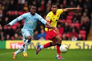 17-03-2012 v Watford, Vicarage Road Collection: Battling for Control: Mariappa vs. Nimely in the Npower Championship Showdown