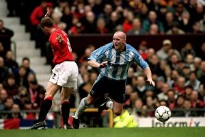 14-04-2001 v Manchester United Collection: Butt Heads: A Tense Moment Between Nicky Butt and John Hartson in the FA Carling Premiership Clash