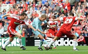 Images Dated 27th August 2011: Carl Baker of Coventry City Clashes with Middlesbrough's McManus and McMahon in Championship Match