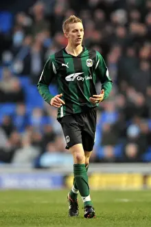 Images Dated 2011 November: Carl Baker Faces Off Against Brighton and Hove Albion at AMEX Stadium - Npower Championship (2011)