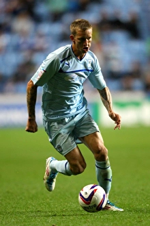 Images Dated 2012 August: Carl Baker Fights Tenaciously in Coventry City's Capital One Cup Battle against Birmingham City at Ricoh Arena
