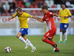 Images Dated 2013 August: Carl Baker vs Gary Sawyer: Intense Rivalry in the Capital One Cup Clash between Leyton Orient and Coventry City