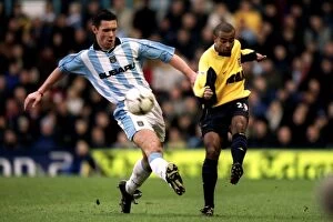 Images Dated 3rd February 2001: Cedric Roussel vs. Ashley Cole: A Football Battle at Coventry City vs