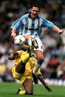 Images Dated 2000: Cedric Roussel vs. Lucas Radebe: A Battle in the FA Carling Premiership - Coventry City vs