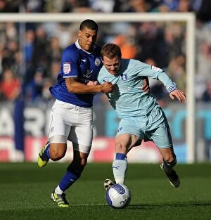 Images Dated 3rd March 2012: Championship Showdown: McSheffrey and Peltier Go Head-to-Head at The King Power Stadium