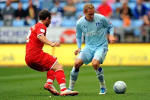 Images Dated 24th September 2011: Chris Hussey vs. Adam Le Fondre: A Championship Showdown at Ricoh Arena - Coventry City vs