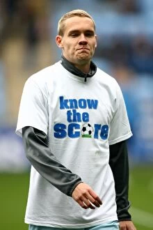 Images Dated 7th April 2012: Chris Hussey's Pre-Match Warm-Up in Know the Score T-Shirt (Coventry City FC vs)