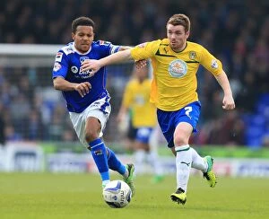 Images Dated 21st April 2014: Clash at Boundary Park: A Battle of Midfield Masters - Korey Smith vs
