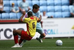 Images Dated 20th August 2011: Clash of the Captains: Jutkiewicz vs Mariappa in Coventry City vs Watford (Npower Championship)