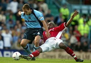 31-08-2002 v Nottingham Forest Collection: Clash at Coventry City Stadium: Eustace vs Harewood's Intense Battle (31-08-2002)