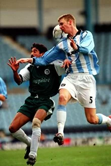 Images Dated 25th March 2001: Clash on the Field: Davenport vs Ullah - Coventry City vs Pakistan Friendly