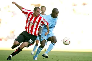 Images Dated 2004: Clash at Highfield Road: A Battle Between Coventry City's Ben Clark and Sunderland's Patrick Suffo (07-08-2004)
