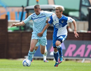 Prints of Bristol Rovers Seanan Clucas and Coventry Citys Billy Daniels Season 2012-13 Prints: Clash at Memorial Ground: A Battle Between Seanan Clucas and Billy Daniels