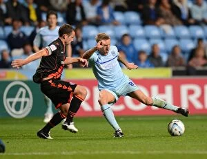 Images Dated 21st August 2012: Clash of the Midfield Maestros: Baker vs Doyle - Coventry City vs Sheffield United