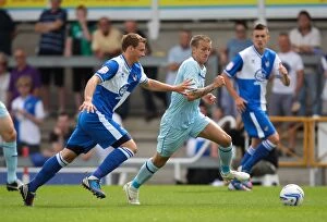 Images Dated 11th August 2012: Clash of the Midfielders: Sean Rowe (Bristol Rovers) vs. Carl Baker (Coventry City)