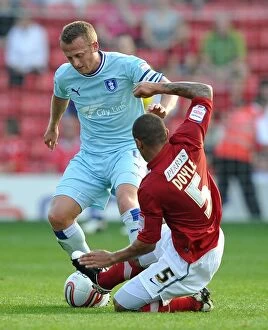 Images Dated 1st October 2011: Clash at Oakwell: Sammy Clingan vs. Nathan Doyle, Coventry City vs
