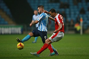 Images Dated 2015 November: Clash at Ricoh Arena: Adam Armstrong vs Lewin Nyatanga - Coventry City vs Barnsley