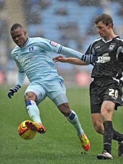 Images Dated 4th February 2012: Clash at Ricoh Arena: Alex Nimely vs Tommy Smith - Npower Championship Showdown (04-02-2012)
