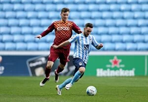 Images Dated 19th April 2016: Clash at Ricoh Arena: Coventry City vs. Bradford City - Intense Moment between Adam Armstrong