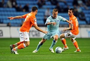 Images Dated 27th September 2011: Clash at Ricoh Arena: Coventry City vs. Blackpool - Gary McSheffrey Faces Off Against Barry