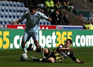 Images Dated 22nd November 2011: Clash at Ricoh Arena: Cyrus Christie vs Craig Conway - A Football Rivalry Unfolds