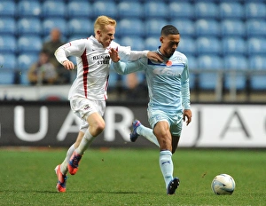 Images Dated 10th November 2012: Clash at Ricoh Arena: Jordan Clarke vs Mark Duffy - Coventry City vs Scunthorpe United