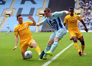 Images Dated 2014 September: Clash at the Ricoh: John Fleck vs Alan Browne - A Battle for Supremacy in Coventry City vs Preston North End