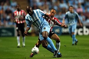 Images Dated 29th August 2005: Clash of Stars: Dele Adebola vs. Djamel Belmadi (Coventry City vs. Southampton, 29-08-2005)